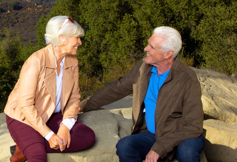 Man and woman converse in nature